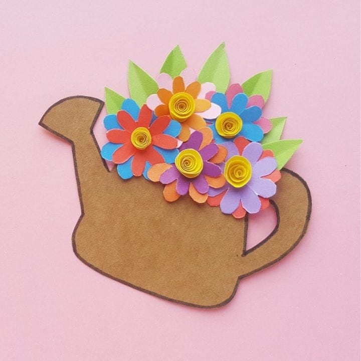 Adorable spring time kids craft. This fun and simple to make paper flower craft looks beautiful when finished. Comes with a free printable paper flower template you can download too!