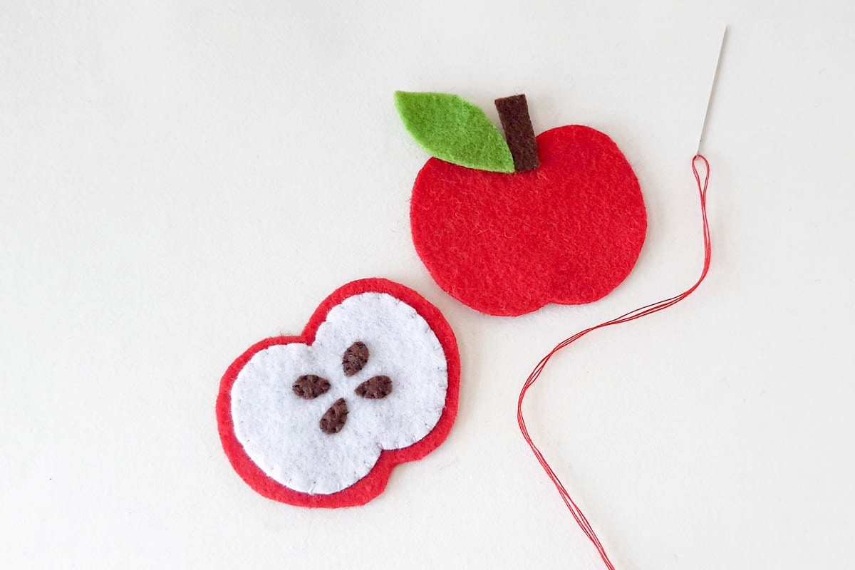 Assembling apple stem and leaf.