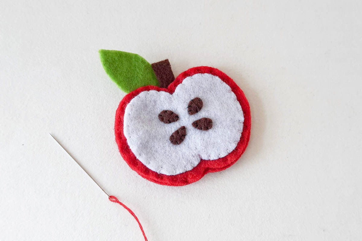Sewing together back of apple template.