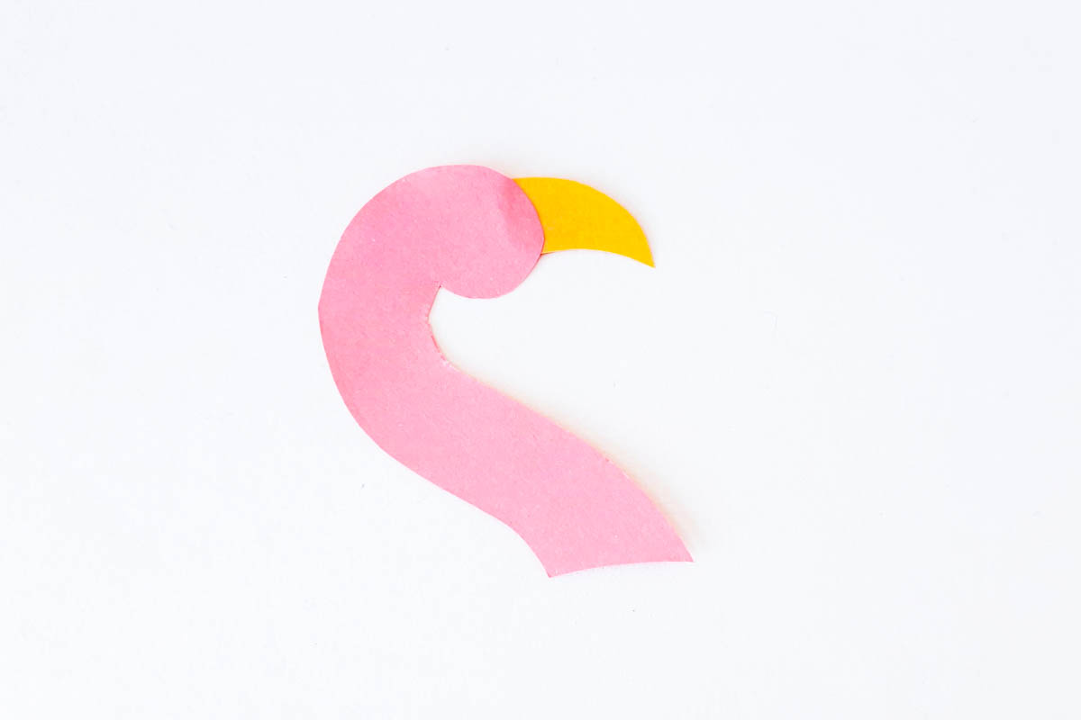 Attaching flamingo beak to head.