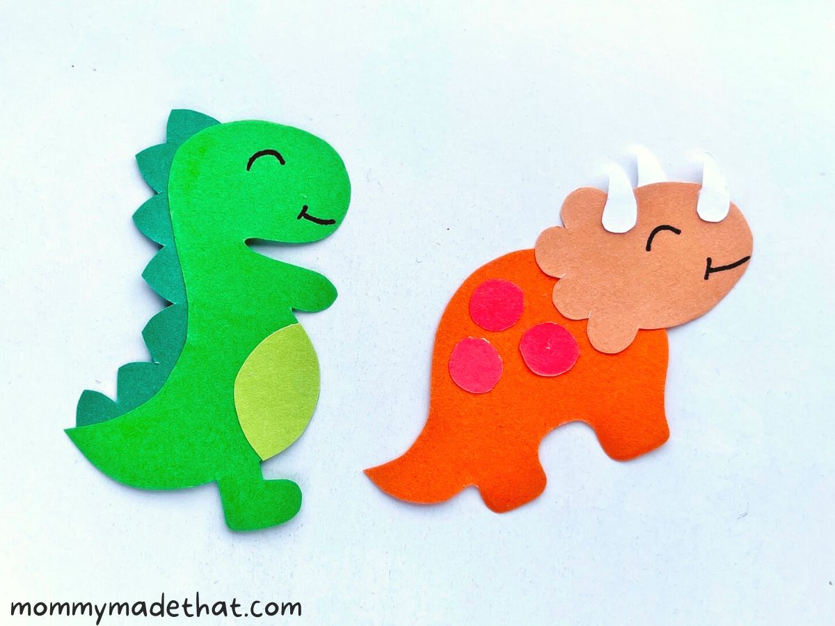 Finished paper dinosaur craft with faces