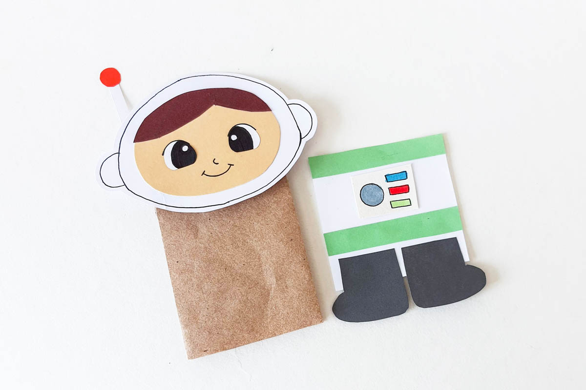 Attaching head to paper bag.