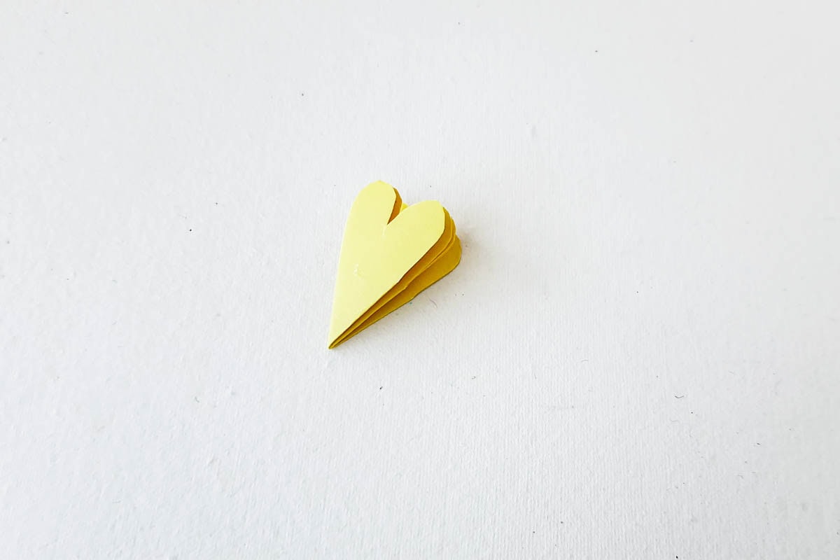 Cutting shape into marigold petal.
