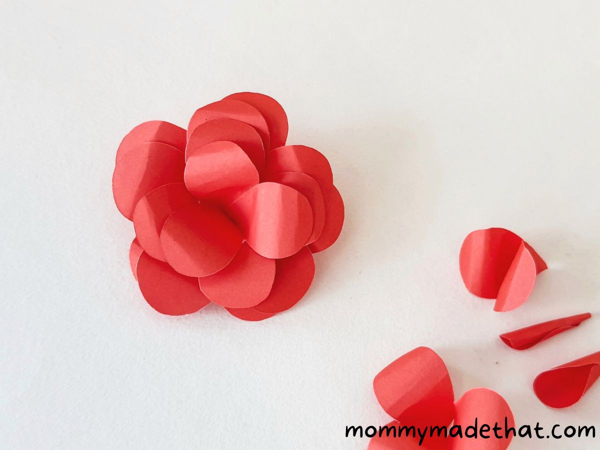 layering petals to make paper rose