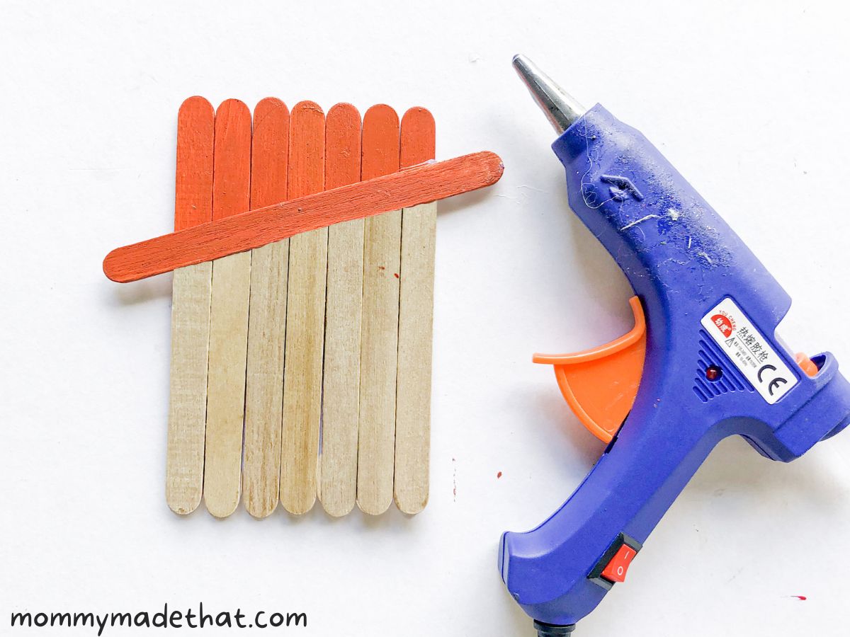 gluing additional popsicle stick to top 