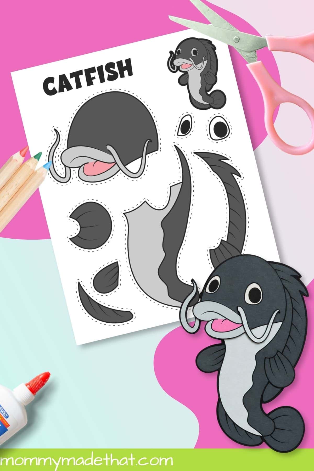 Assembled catfish printable craft beside scissors and template