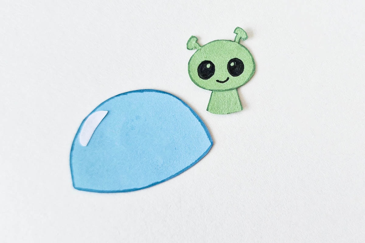 Drawing face on alien.