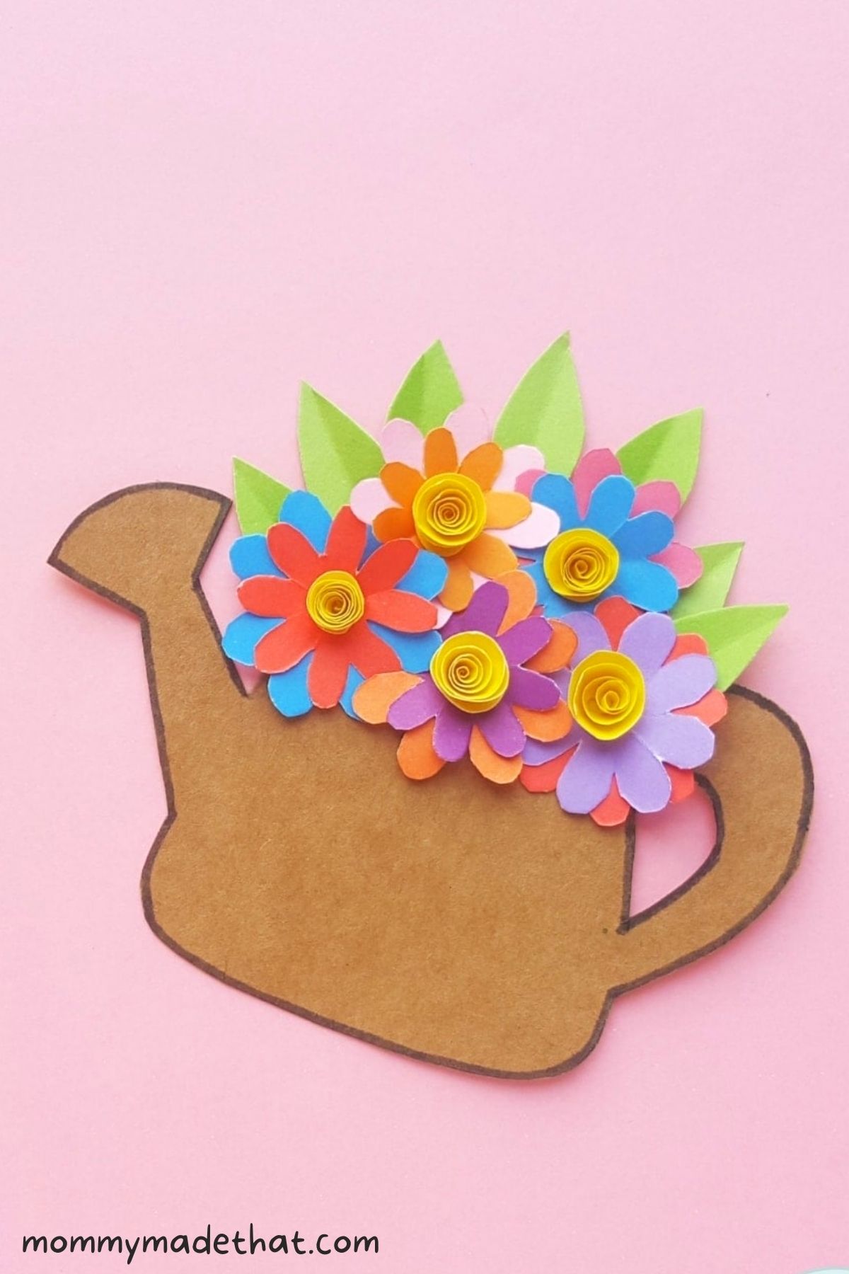 paper flowers in a paper watering can