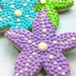 colorful starfish mermaid cookies with royal icing