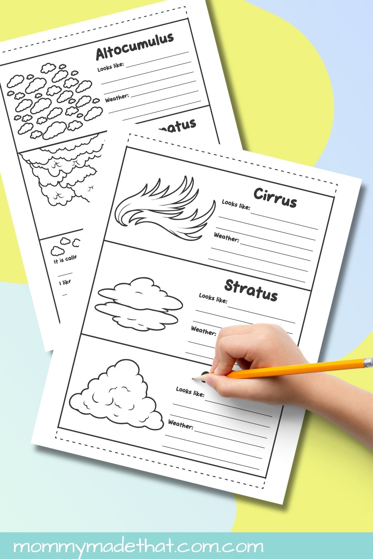 Hand writing on a cloud foldable worksheet with cirrus, stratus, and cumulus illustrations.